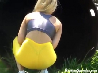 in yellow leggings